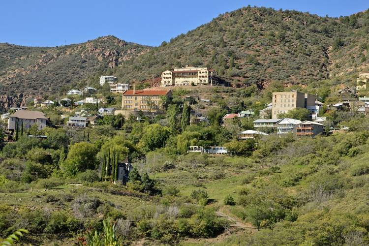 a long view of the mansion in jerome, arizona, overlooking the ghost town