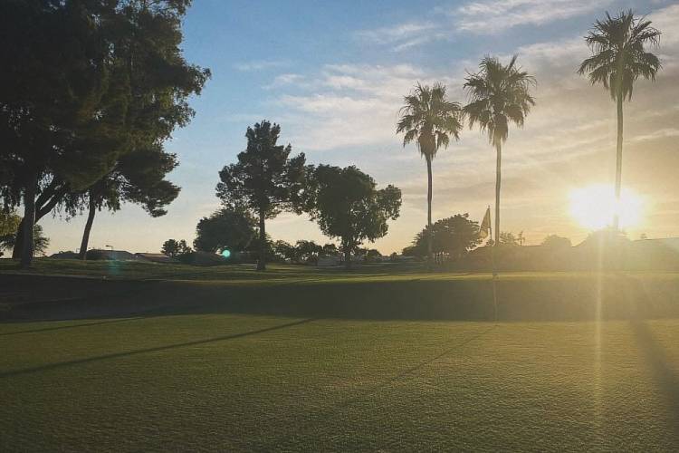 Sunrise on one of the greens at springfield golf course in chandler, arizona